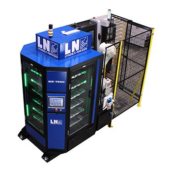 EZ-TEND Web 350x350-Copy-1 A blue and black industrial automation machine with a touchscreen panel, labeled LN and Lyndex-Nikken, enclosed by a safety fence and illuminated green lights inside.