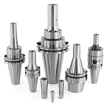 MMC Collet Chucks - Web 350x350 Six precision-machined metal tool holders of varying sizes are arranged upright on a white background. The holders have cylindrical shapes with flared bases and shiny, metallic finishes.