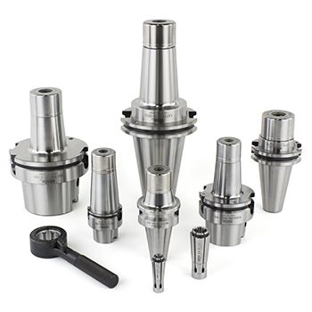 VC Collet Chucks - Web 350x350 Six metal tool holders of various sizes are arranged upright, with a black spanner wrench and two collets placed in front of them, all displayed on a plain white background.