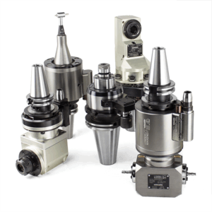 A group of five precision metal CNC angle heads and spindle speeders arranged upright on a white background. The components feature various cylindrical and conical shapes with engraved labels and attached fixtures.