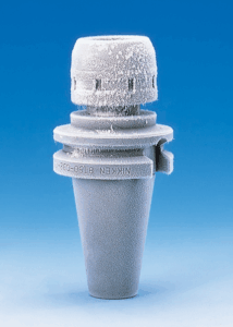 A Nikken Milling Chuck with a frosted surface stands upright against a gradient blue background. Frost covers the top and upper sections, showing the sub-zero cryogenic treatment process.