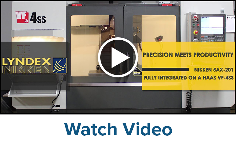 A CNC machine with LYNDEX NIKKEN branding and the text PRECISION MEETS PRODUCTIVITY NIKKEN 5AX-201 FULLY INTEGRATED ON A HAAS VF-4SS appears behind a play button overlay. A control panel is on the right.