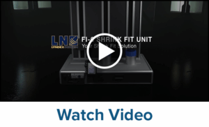 A machine labeled LYNDEX-NIKKEN FI-6 SHRINK FIT UNIT with a play button overlay is shown against a dark background. Text below the image says Watch Video.
