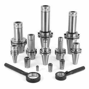 A group of metal tool holders, collets, and two wrenches arranged on a white surface.