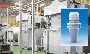 A factory floor with large industrial machines; an inset shows a close-up of a tool holder, coated in frost, against a blue background.