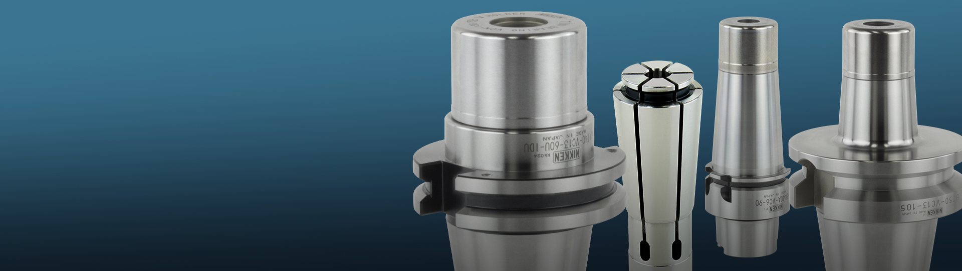 Three VC Collet Chucks and one VC Collet are displayed upright on a reflective surface against a blue gradient background.